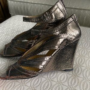 Brand New, never worn.  Dani Black metallic wedge heels, size 9.
